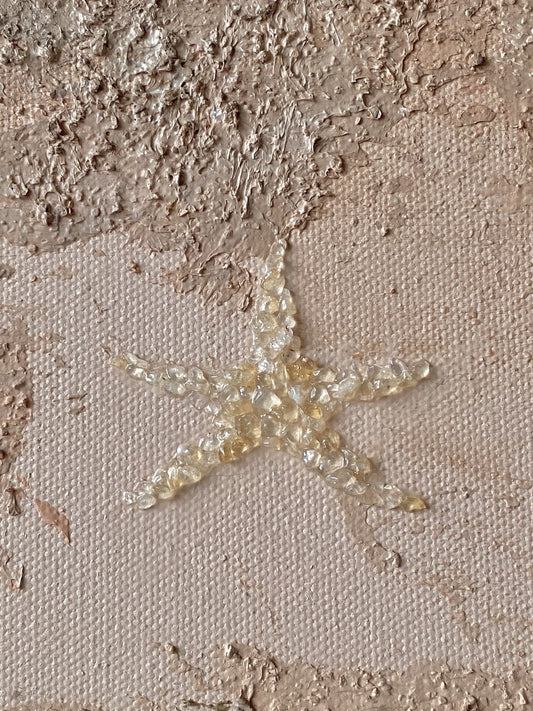 Closeup detail of a starfish made of citrine crystals embedded at the bottom centre of "Body of Water No. 4" textured canvas.