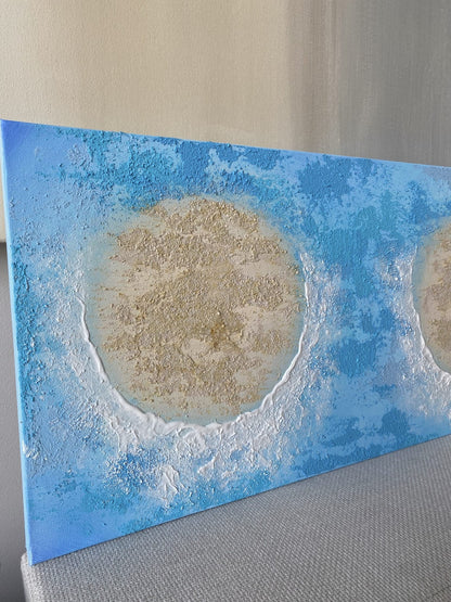 Side view of hand-painted textured canvas showing sandy islands and ocean blue waves with natural crystal detailing.