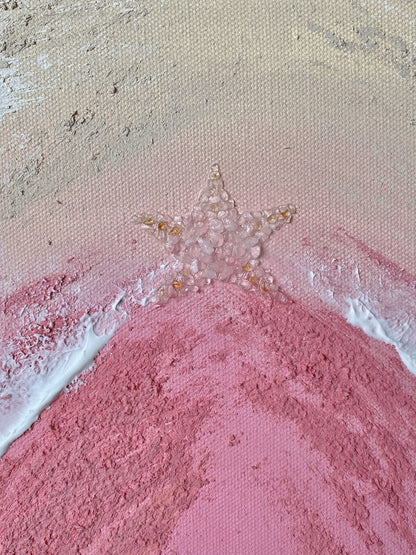 Top closeup of crystal star detail featuring rose quartz and citrine on textured pink abstract beach artwork.